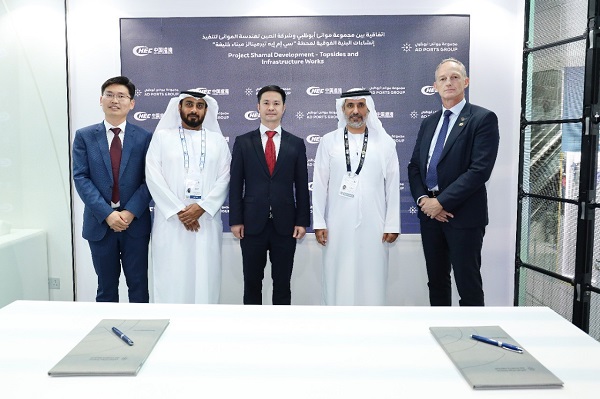 Saif Al Mazrouei, CEO, Ports Cluster, AD Ports Group (second to the right); and Yang Zhiyuan, CEO of CHEC Middle East Division (middle), with officials during the signing ceremony of the contract for the development of buildings and topside infrastructure for the cutting-edge CMA Terminals Khalifa Port