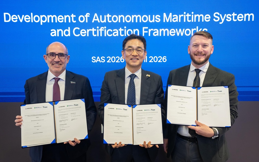 Paul Karam, ABS Executive Vice President, Operations; Kwang-Pil Chang, Senior Executive Vice President and Chief Technology Officer, HD Korea Shipbuilding & Offshore Engineering; and Cory Emmons, General Manager, Surface Dominance Division, Anduril Industries, at a signing ceremony during the 2026 Sea Air and Space Expo in National Harbor, Maryland.
