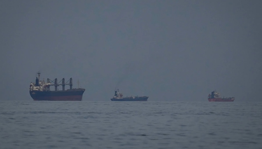 Oil tankers and ships line up in the Strait of Hormuz as seen from Khor Fakkan, United Arab Emirates on March 11.Photographer: Altaf Qadri/AP Photo