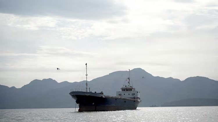 A vessel in the Strait of Hormuz, off the coast of Oman’s Musandam province, April 12, 2026. REUTERS
