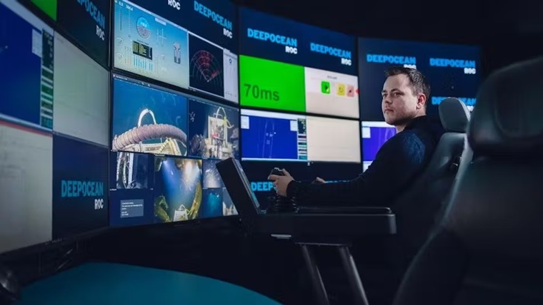 An operator manages remote subsea operations from land.