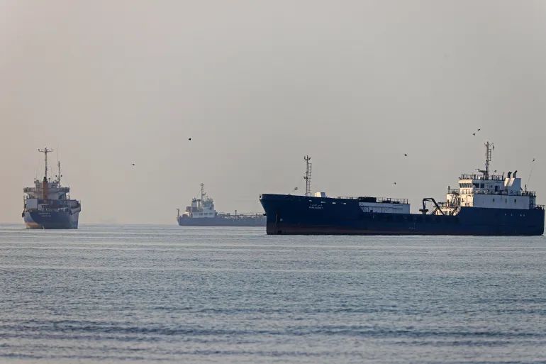 Commercial vessels off the coast of Bandar Abbas in the Strait of Hormuz (AFP)
